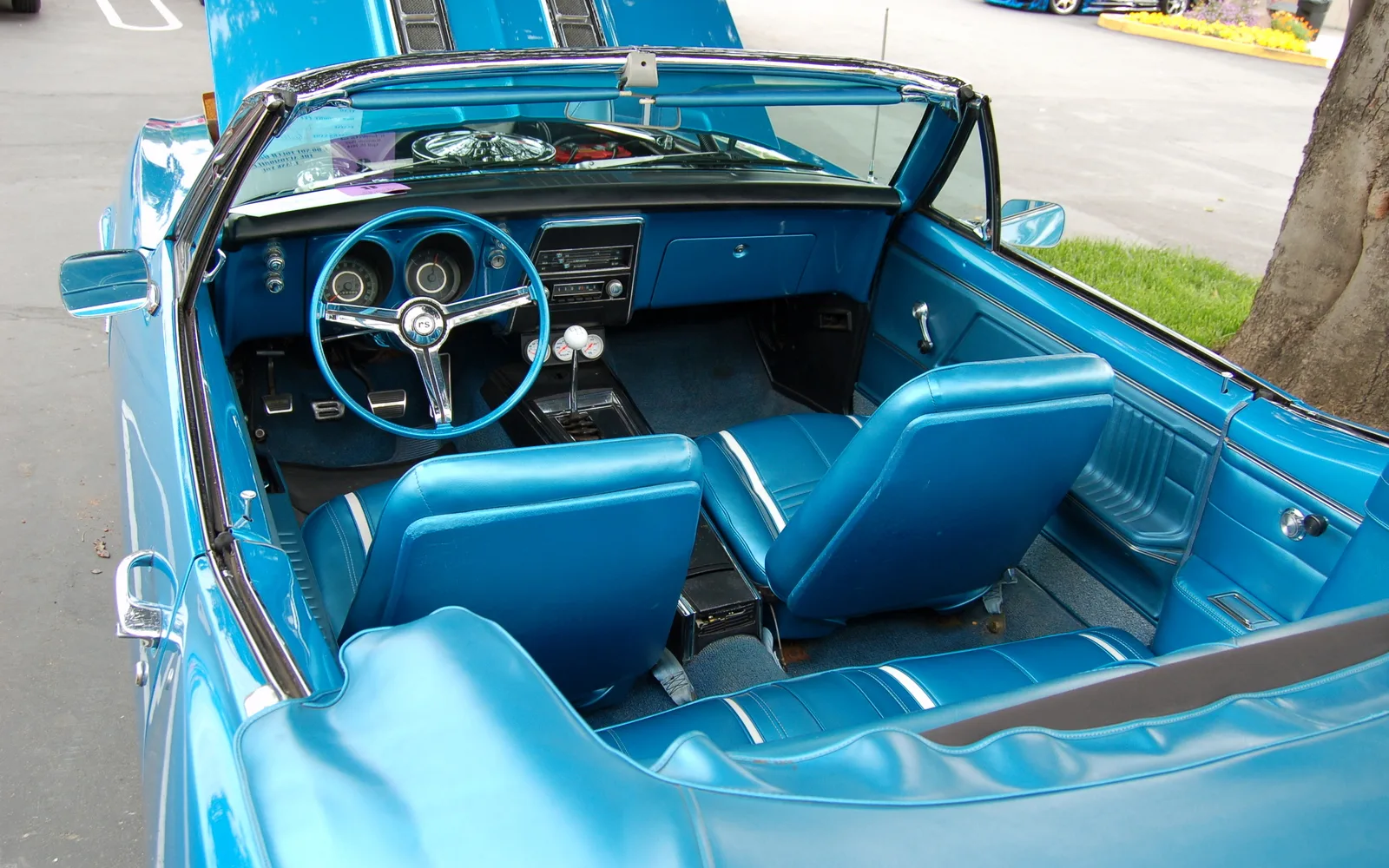Blue classic-car interior photographed at a Modesto vehicle show
